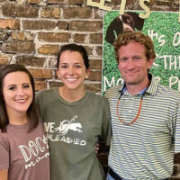 People posing at private party